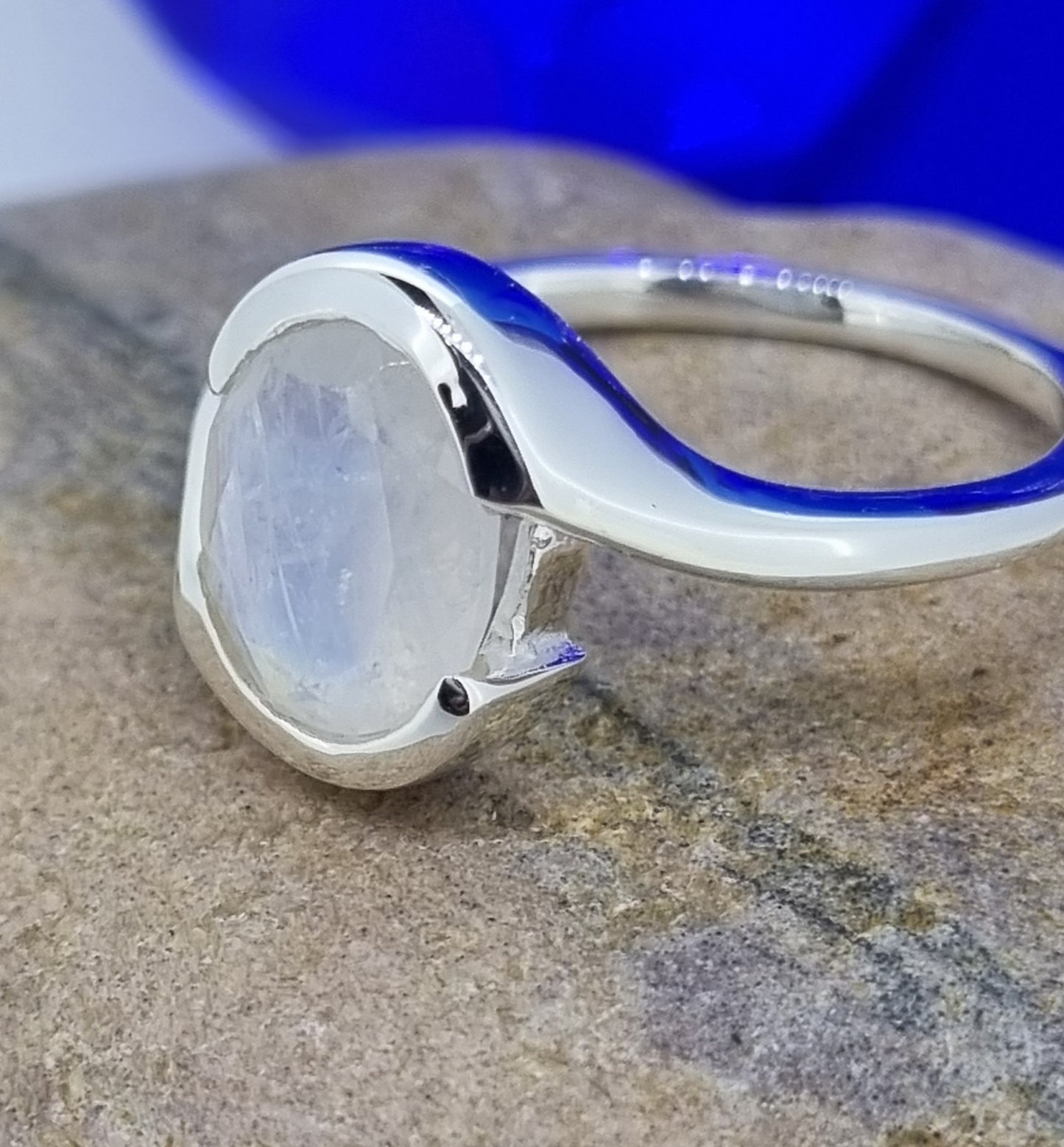 Blue Moonstone Shimmering & Engulfed In A Bed Of Sterling Silver Band Ring